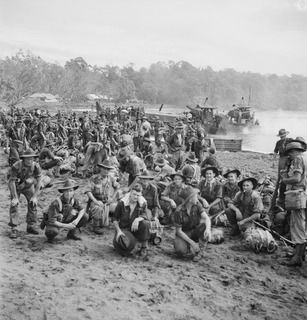 KILIGIA, NEW GUINEA. 1944-04-20. MEMBERS OF THE 30TH INFANTRY BATTALION ON THE BEACH ABOUT TO EMBARK ABOARD LCM'S (LANDING CRAFT MECHANIZED) FOR FINSCHHAFEN. THEY WILL THEN TRAVEL TO SAIDOR BY ..