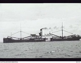 PORT MORESBY, PAPUA. 1941-12-11. PORT SIDE VIEW OF THE AMERICAN CARGO VESSEL COAST SHIPPER. NOTE THE NOW UNNECESSARY PROMINENT NATIONAL FLAG INDICATING HER NEUTRALITY. (NAVAL HISTORICAL COLLECTION)