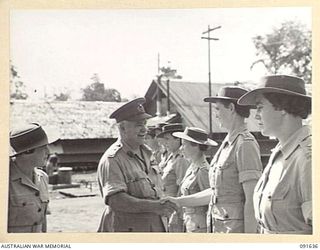 LAE, NEW GUINEA. 1945-05-11. GENERAL SIR THOMAS A. BLAMEY, COMMANDER-IN-CHIEF, ALLIED LAND FORCES, SOUTH WEST PACIFIC AREA (2), SHAKING HANDS WITH LIEUTENANT J.D. LOVE (5), DURING AN INSPECTION OF ..