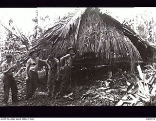 FARIA VALLEY, NEW GUINEA. 1943-10-17. THE SALVATION ARMY RED SHIELD HUT AT THE 2/16TH AUSTRALIAN INFANTRY BATTALION POSITIONS NEAR JOHN'S KNOLL. LEFT TO RIGHT: WX2997 PRIVATE (PTE) J. J. BACCHUS; ..