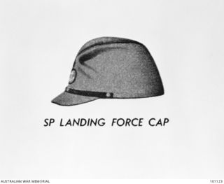 Canberra, ACT. 1960-04-20. Taken at the Australian War Memorial, showing a cap of the South Pacific Landing Force (Japanese Navy). The colour of the is cap - light olive green; badge, buttons and ..