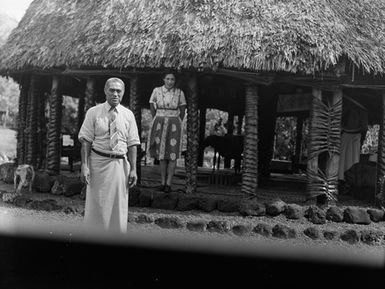 [Portrait of a man and woman standing outside a fale]