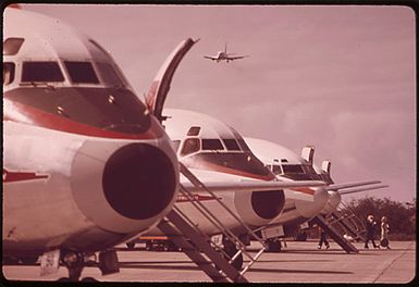AIRLINERS AT MAUI ISLAND. JET TRAVEL BETWEEN THE ISLANDS IS A CAUSE OF RAPID DEVELOPMENT. SEA TRAVEL HAS NOT BEEN UTILIZED IN THE TOURIST TRADE