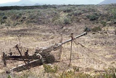 Members of Battery C, 1ST Bn., 12th Marines, prepare an M-198 155mm howitzer for a move to another position during operation Valiant Fire II