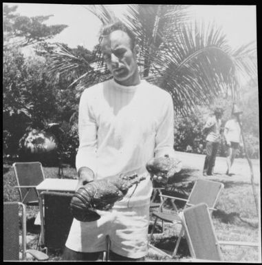A man holding a lobster, New Caledonia, 1967 / Michael Terry