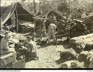 TOROKINA, BOUGAINVILLE ISLAND, SOLOMON ISLANDS. 1945-01-28. CLOSE CO-OPERATION BETWEEN AUSTRALIAN MILITARY FORCES AND RAAF IS HAVING SUCCESSFUL RESULTS. AN ARMY SIGNALLER RECEIVING FIRE ORDERS FROM ..