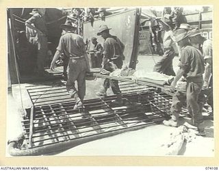 HANSA BAY, NEW GUINEA. 1944-06-16. CHINESE BEING TAKEN ABOARD AMERICAN ARMY BARGES FOR TRANSPORT TO MADANG. THESE PEOPLE WERE MEMBERS OF A PARTY OF SOME 90 CHINESE WHO WERE CAPTURED BY THE JAPANESE ..