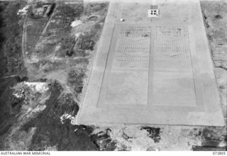 SALAMAUA, NEW GUINEA. 1944-04-30. AN AERIAL VIEW OF SALAMAUA WAR CEMETERY FROM A STINSON MONOPLANE AIRCRAFT FLOWN BY Q14251 CAPTAIN N. R. WILDE, AUSTRALIAN NEW GUINEA ADMINISTRATIVE UNIT, LIAISON ..