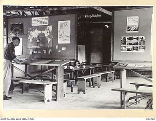 LAE AREA, NEW GUINEA, 1945-08-10. THE INTERIOR OF THE CHARING CROSS EDUCATION CENTRE UNDER THE COMMAND OF THE DEPUTY ASSISTANT DIRECTOR OF EDUCATION, LAE BASE SUB-AREA