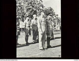 BUNA, NEW GUINEA. C. 1943. BRIGADIER GENERAL ENNIS C. WHITEHEAD, COMMANDING GENERAL ALLIED AIR FORCE IN NEW GUINEA, WITH AIR COMMODORE J. E. HEWITT, AIR OFFICER COMMANDING RAAF IN NEW GUINEA, ON ..