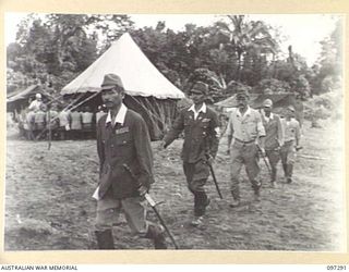 BUIN AREA, BOUGAINVILLE. 1945-09-13. JAPANESE STAFF OFFICERS DEPARTING FROM A CONFERENCE WITH MEMBERS OF THE AUSTRALIAN SURRENDER PARTY FROM HEADQUARTERS 2 CORPS HELD AT KAHILI BEACH. THE ..