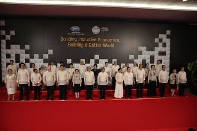 Barack Obama joins Asia Pacific Economic Cooperation Summit leaders and spouses for a group photo in Pasay, Metro Manila, Philippines, November 18, 2015