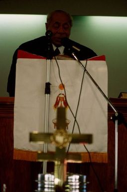 King Taufa'ahau Tupou IV speaking from the pulpit at the dedication of Vaine Mo'onia (The True Vine) church