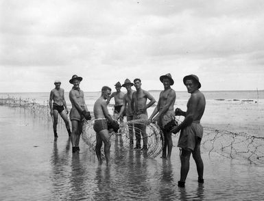 South Pacific - Fiji - New Zealand soldiers setting up barbed wire entanglements, Viti Levu