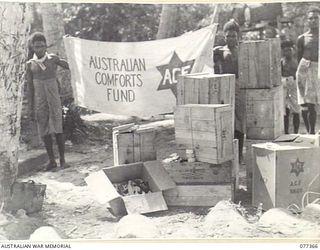 NEW GUINEA. 1944-12-14. BOXES OF AUSTRALIAN COMFORTS FUND GOODS READY FOR DESPATCH TO THE TROOPS IN THE AREA