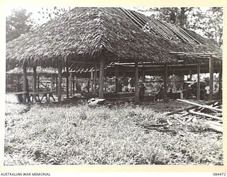 LAE, NEW GUINEA. 1944-12-22. A NEW BUILDING BEING ERECTED BY NATIVE LABOUR SUPPLIED BY ANGAU FOR THE YMCA
