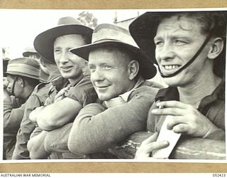 HERBERTON, QLD. 1943-06-12. THESE TROOPS WERE ON THE WINNER OF THE FIRST RACE, THE STAWELL GIFT, AT THE 6TH AUSTRALIAN DIVISION RACE MEETING