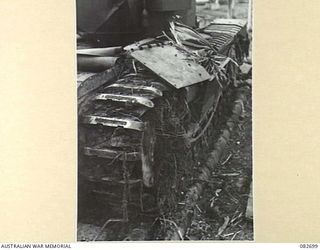 MADANG, NEW GUINEA. 1944-10-12. A CHURCHILL V TANK FITTED WITH AN IMPROVISED WIRE REMOVING MUD PLOUGH USED IN TESTS AT HQ 4 ARMOURED BRIGADE