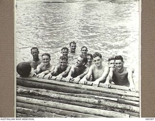 LALOKI RIVER, NEW GUINEA. 1943-11-09. A GROUP OF COMPETITORS IN THE 7TH AUSTRALIAN INFANTRY BRIGADE SIGNALS SWIMMING CARNIVAL. THEY ARE: QX39827 SIGNALMAN D. W. SWEET (1); QX56649 SIGNALMAN W. A. ..