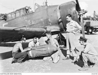 TOROKINA, BOUGAINVILLE ISLAND, SOLOMON ISLANDS. C. 1945-01-27. TWO MEMBERS OF NO. 5 (TACTICAL RECONNAISSANCE) SQUADRON RAAF, FLIGHT LIEUTENANT I. C. CURTIS DFC, OF BALLARAT, VIC, AND FLYING OFFICER ..