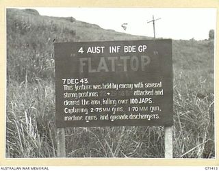 FLAT TOP FEATURE, FINSCHHAFEN AREA, NEW GUINEA. 1944-03-21. THE BATTLE SIGN MARKING THE ADVANCE OF THE 29/46TH AND THE 22ND INFANTRY BATTALIONS, 4TH INFANTRY BRIGADE GROUP ON THE 1943-12-07