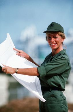 CPT Elizabeth King, a civil engineer, displays a blueprint