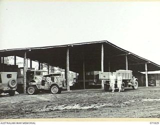 LAE, NEW GUINEA. 1944-03-29. A TRAFFIC SHED AT THE 43RD FIELD ORDNANCE DEPOT MEASURING 105 FEET BY 60 FEET, WHICH WAS CONSTRUCTED IN TEN DAYS BY EIGHT MEN AND FOUR NATIVES