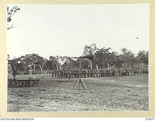 POM POM VALLEY, NEW GUINEA, 1944-02-16. NX8 LIEUTENANT-GENERAL SIR LESLIE MORSHEAD, KCB., KBE., CMG., DSO., ED., (3) GENERAL-OFFICER-COMMANDING NEW GUINEA FORCE, TAKES THE SALUTE AT THE FAREWELL ..