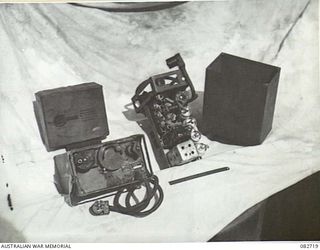 MADANG, NEW GUINEA. 1944-10-12. THE UNDER SIDE OF A NO. 38 SET AND ITS SIDE COMPONENT, WITH THEIR COVERS REMOVED. THE SET IS USED IN TANKS ENGAGED IN TESTS AT HQ 4 ARMOURED BRIGADE