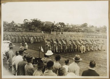 Brigadier W H Cunningham, CBE DSO VD, Officer Commanding the forces in Fiji, taking the salute during the Anzac Day parade in Suva - Photograph taken by an unknown photographer