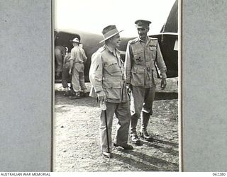 DUMPU, NEW GUINEA. 1943-12-19. VX1 GENERAL SIR THOMAS BLAMEY, GBE., KCB., CMG., DSO., ED., COMMANDER-IN-CHIEF, ALLIED LAND FORCES, SOUTH WEST PACIFIC AREA (1) BEING GREETED ON HIS ARRIVAL AT THE ..