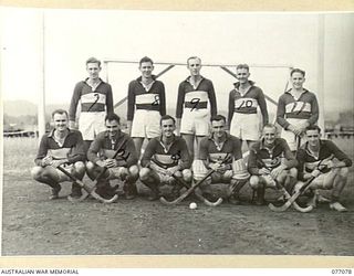 LAE, NEW GUINEA. 1944-11-18. THE HOCKEY TEAM OF B COMPANY, 18TH FIELD AMBULANCE WHO ARE TO PLAY AN OPPOSING A COMPANY TEAM ON THE UNIT SPORTS GROUND. IDENTIFIED PERSONNEL ARE:- STAFF SERGEANT A.C. ..