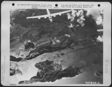 On 25 November 1944 Consolidated B-24 Liberators Of The 865Th And 867Th Bomb Squadrons, 494Th Bomb Group, Participated In A Raid On Arakbesan Island, Palau Islands, Caroline Group. Here A B-24 Flies Over The Smoking Target. (U.S. Air Force Number 70780AC)