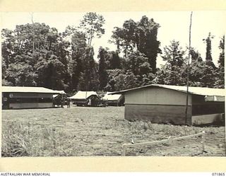 LAE, NEW GUINEA. 1944-03-30. THE MESS AND ORDERLY ROOM AT THE 55TH BULK ISSUE PETROL AND OIL DEPOT PLATOON
