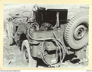 BOUGAINVILLE ISLAND. 1945-02-22. A SLAVE CHARGER FITTED INTO A JEEP OF B SQUADRON WORKSHOP, 2/4TH ARMOURED REGIMENT. THE DESIGN AND FITTING OF THESE UNITS WAS DONE BY THE UNIT WORKSHOP PERSONNEL