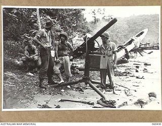 GODOWA, NEW GUINEA. 1943-11-05. NX35229 PRIVATE K. J. BURGESS OF WAGGA WAGGA, NSW, AND OF THE 2/3RD AUSTRALIAN PIONEER BATTALION (1) TALKING TO PRIVATE A. SPORTINI OF CONNECTICUT, USA, (2) AND ..