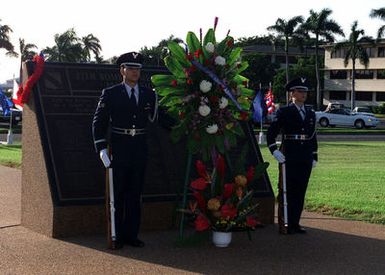 US Air Force SENIOR Airmen (SRA) Jose Olivieri (left) and SRA Pamela Varon of the 15th Air Base Wing Honor Guard, Hickam AFB, Hawaii, stand guard at 11th Bombardment Wing Memorial at Hickam AFB, Hawaii during the Wreath Laying Ceremony