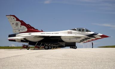 U.S. Air Force TECH. SGT. Brian Plauche, a Crew CHIEF assigned to the U.S. Air Force Thunderbirds Aerial Demonstration Team, marshals the F-16C Fighting Falcon aircraft into position, after the Team Landed at Andersen Air Force Base, Guam, September 9, 2004. This landing marks the first time in a decade the USAF Thunderbird demonstration team has visited Guam. The Thunderbirds will be performing during an air show held Sunday, September 12, 2004. (U.S. Air Force PHOTO by STAFF SGT. Bennie J. Davis III) (Released)