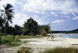 Fiji, people walking on beach on Yasawa Island