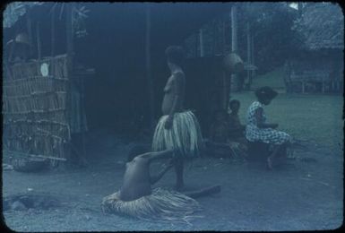 Trimming a skirt : Mapamoiwa Station, D'Entrecasteaux Islands, Papua New Guinea, 1956-1959 / Terence and Margaret Spencer