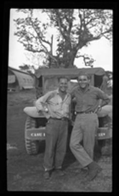 [Elmer A. Ball and other serviceman with jeep]