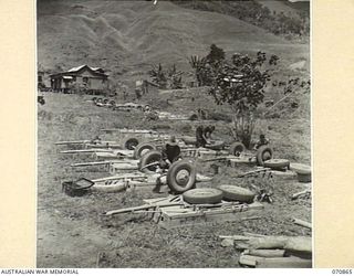 WAU, NEW GUINEA, 1944-02-20. SOME OF THE FIFTY JEEP TRAILERS UNDERGOING REPAIR BY MECHANICS IN THE 2/34TH GENERAL TRANSPORT COMPANY CAMP. CHANGES IN TEMPERATURE AND ROUGH ROADS CAUSE BREAKAGES IN ..