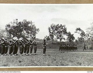 POM POM VALLEY, NEW GUINEA. 1943-11-27. GUARD OF THE 2/10TH AUSTRALIAN INFANTRY BATTALION, THE CHAMPIONS OF THE 18TH AUSTRALIAN INFANTRY BRIGADE, PARADING DURING THE TAKING OF A TRAINING FILM FOR ..