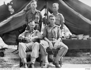 MILILAT, NEW GUINEA. 1944-08-31. THE STAFF OF THE ASSISTANT DIRECTOR OF MEDICAL SERVICES OUTSIDE THEIR TENT IN THE CAMP AREA OF HEADQUARTERS, 8TH INFANTRY BRIGADE. IDENTIFIED PERSONNEL ARE: VX39239 ..