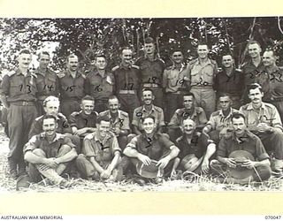 KELANOA, NEW GUINEA. 1944-01-23. SOME OF THE OFFICERS OF THE 2/15TH INFANTRY BATTALION WHO WERE IN ACTION IN THE FINSCHHAFEN AREA AND THE PURSUIT TO SIO. IDENTIFIED PERSONNEL ARE: QX17354 ..