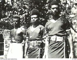 LAE, NEW GUINEA. 1944-04-01. NATIVE BOYS AFTER PRESENTATION WITH MEDALS FOR BRAVERY BY MAJOR GENERAL B.M. MORRIS, DSO, THE GENERAL OFFICER COMMANDING AUSTRALIAN NEW GUINEA ADMINISTRATIVE UNIT. ..