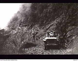 REINHOLD HIGHWAY, NEW GUINEA. 1943-08-23. CONVOY OF HEADQUARTERS, ROYAL AUSTRALIAN ENGINEERS, 11TH AUSTRALIAN DIVISION, ON THE NEWLY COMPLETED HIGHWAY AT THE ELOA BASIN