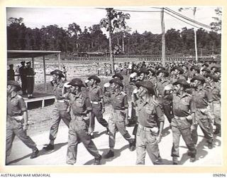 TOROKINA, BOUGAINVILLE. 1945-09-24. BRIGADE STAFF OFFICERS SALUTING AS THEY PASS THE SALUTING BASE DURING THE MARCH PAST OF 15 INFANTRY BRIGADE TROOPS AT GLOUCESTER PARK. THE SALUTE WAS TAKEN BY ..