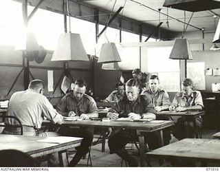 PORT MORESBY, PAPUA, NEW GUINEA. 1944-03-13. THE INTERIOR OF THE CIPHER ROOM AT THE 18TH LINES OF COMMUNICATION SIGNALS, HEADQUARTERS NEW GUINEA FORCE