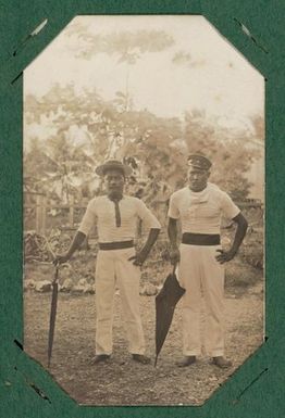 Two men with umbrellas.  From the album: Banaba (Ocean Island)